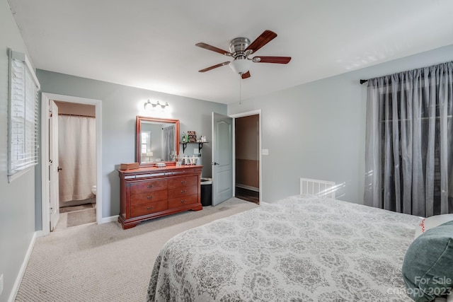 carpeted bedroom featuring ceiling fan and connected bathroom