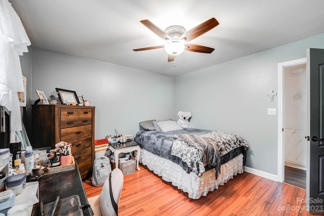 bedroom with wood-type flooring and ceiling fan