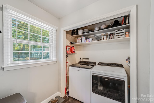 washroom with washer and clothes dryer, dark hardwood / wood-style floors, and a wealth of natural light