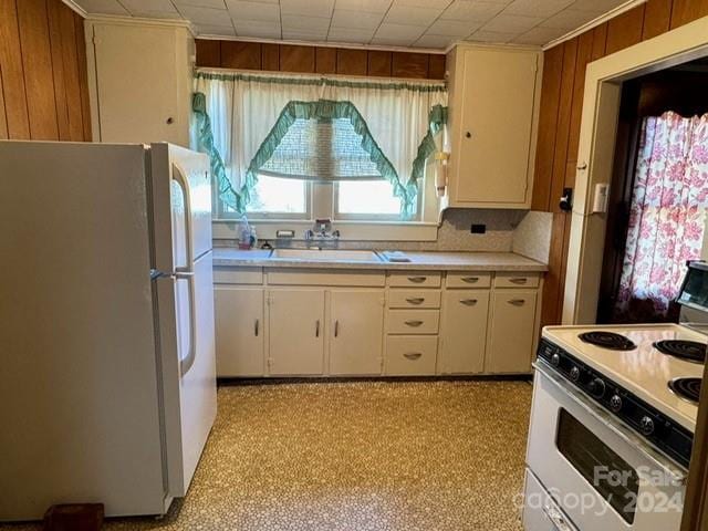 kitchen featuring white appliances and sink