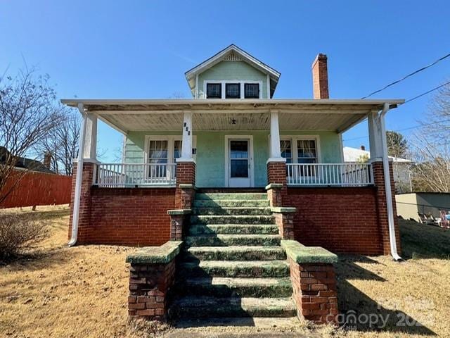 bungalow-style house featuring covered porch