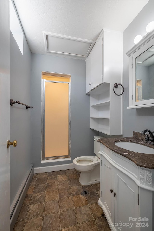 bathroom with a shower with door, toilet, tile flooring, vanity, and a baseboard radiator