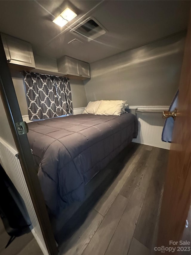 bedroom featuring hardwood / wood-style flooring