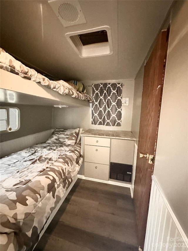 bedroom featuring dark wood-type flooring