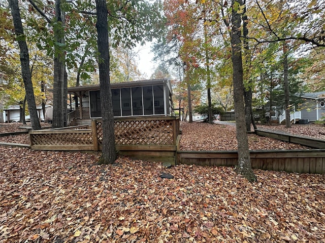 back of property featuring a sunroom