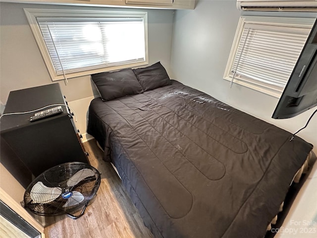 bedroom featuring dark hardwood / wood-style flooring