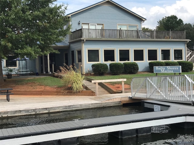 back of property with a balcony