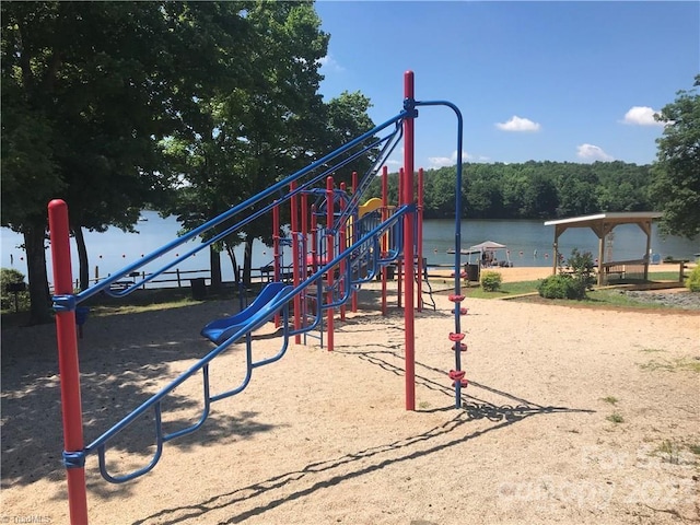 view of jungle gym with a water view