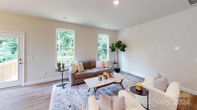 living room with light hardwood / wood-style floors