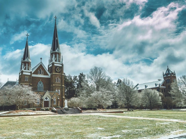 surrounding community featuring a lawn