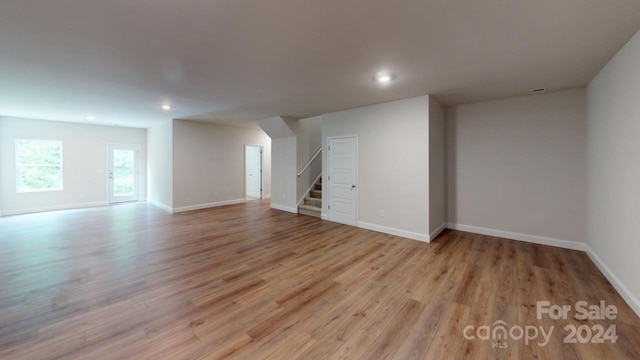 basement with light hardwood / wood-style floors