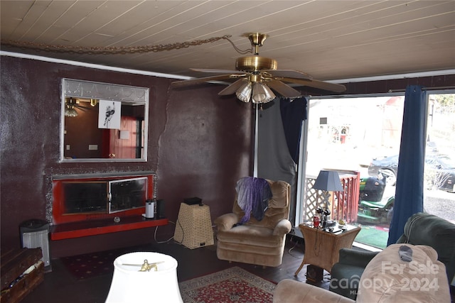 living room with ceiling fan and wood ceiling