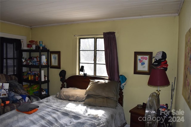 bedroom with crown molding