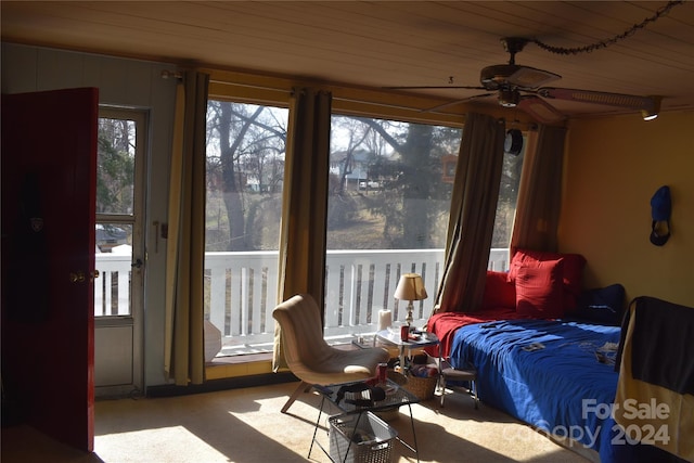 bedroom featuring ceiling fan, wood ceiling, and multiple windows