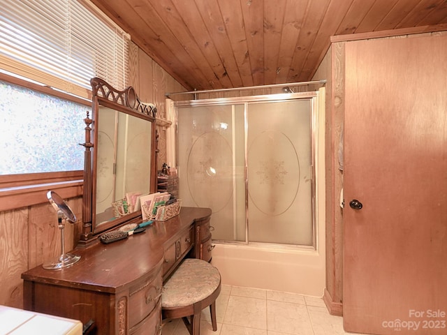 bathroom featuring shower / bath combination with glass door, wood ceiling, vanity, a healthy amount of sunlight, and wooden walls