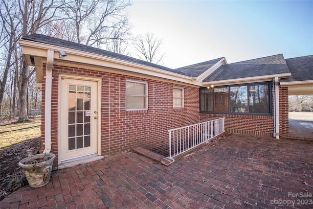 rear view of property featuring a patio area