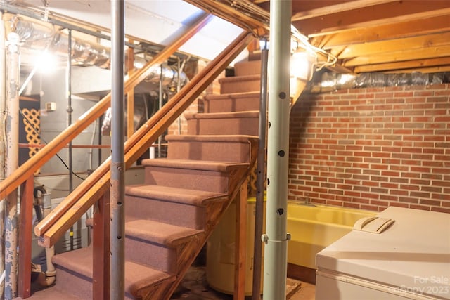 3616 County Home Rd, Conover, NC 28613 - unfinished below grade area featuring stairway and brick wall