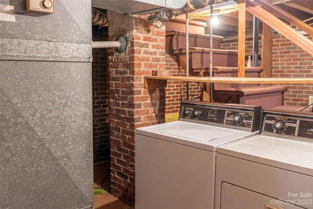 3616 County Home Rd, Conover, NC 28613 - washroom with laundry area, washing machine and dryer, and brick wall