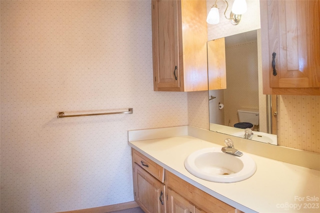 3616 County Home Rd, Conover, NC 28613 - bathroom featuring wallpapered walls, toilet, and vanity