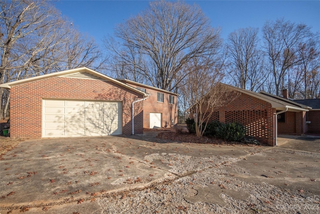 3616 County Home Rd, Conover, NC 28613 - view of property exterior with concrete driveway, a garage, and brick siding