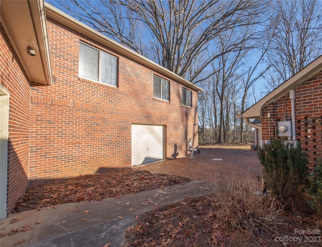 3616 County Home Rd, Conover, NC 28613 - view of side of property with brick siding and an attached garage