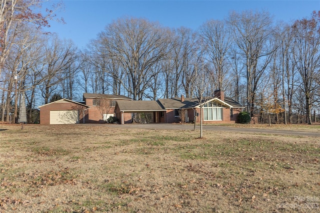 3616 County Home Rd, Conover, NC 28613 - ranch-style home featuring brick siding, a chimney, a front lawn, and a carport