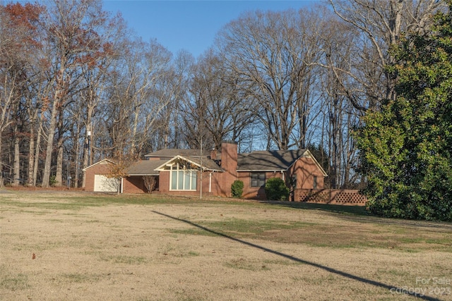 ranch-style house with a front lawn