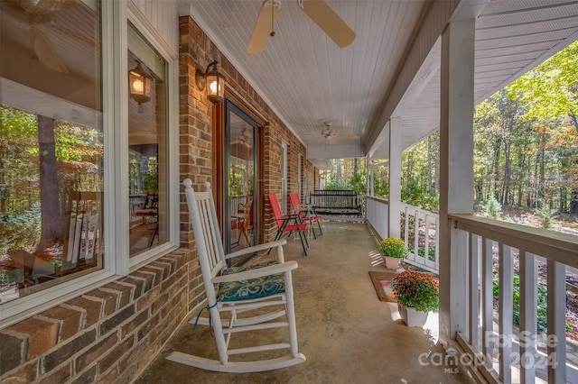 view of terrace featuring ceiling fan and a porch