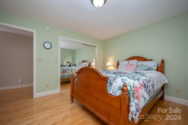 bedroom with a closet and light wood-type flooring