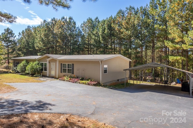 view of side of property featuring a carport