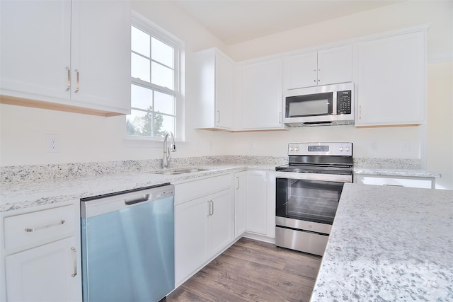 kitchen featuring sink, stainless steel appliances, and white cabinets