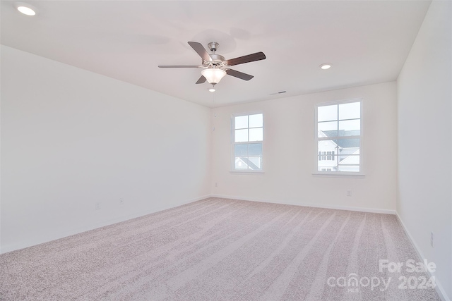 carpeted empty room with ceiling fan