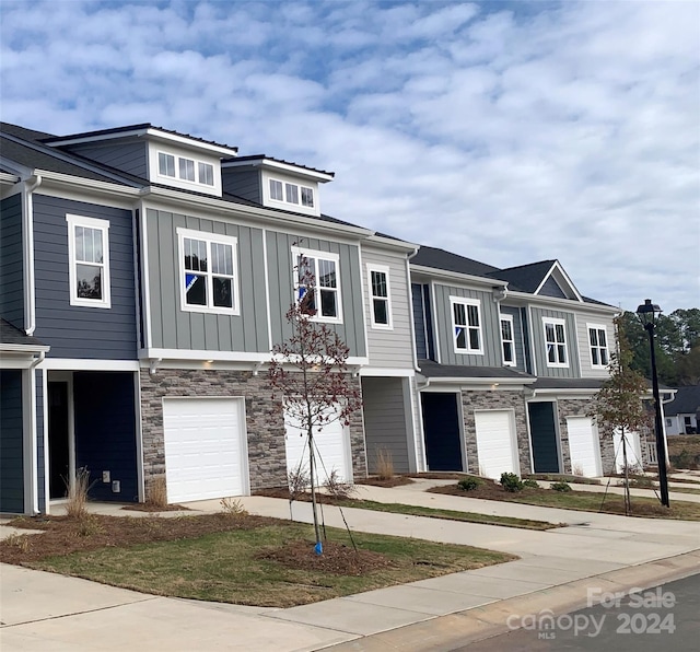 townhome / multi-family property featuring a garage