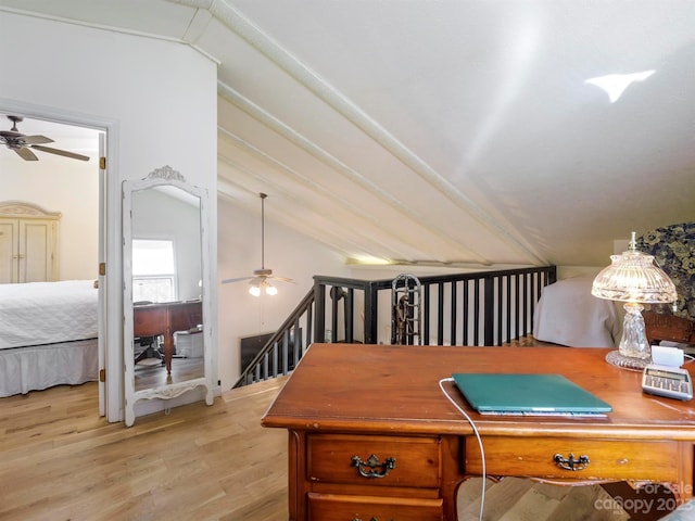 office with ceiling fan, light wood-type flooring, and vaulted ceiling