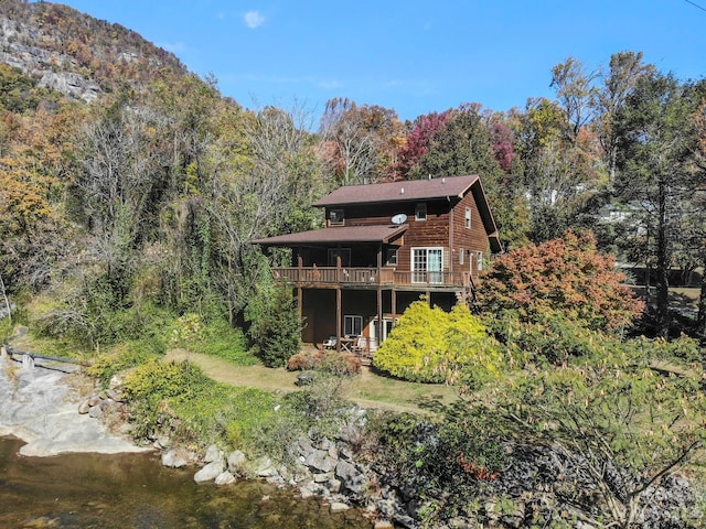 rear view of property with a deck