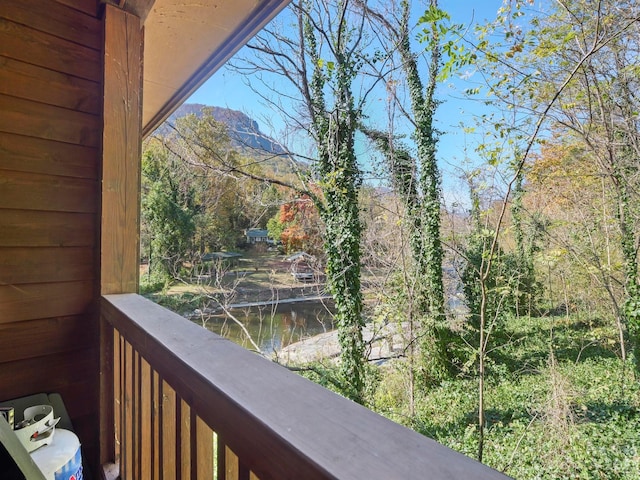 balcony featuring a water view