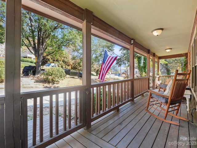 wooden terrace featuring a porch