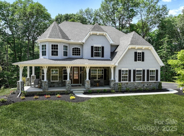 843 Lake Forest Drive Devonshire, Belmont, NC 28012 - view of front of property with a shingled roof, stone siding, covered porch, and a front yard