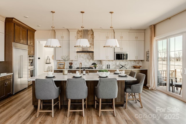 843 Lake Forest Drive Devonshire, Belmont, NC 28012 - kitchen featuring appliances with stainless steel finishes, light countertops, and decorative backsplash