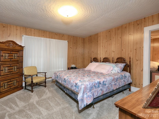 carpeted bedroom with wooden walls