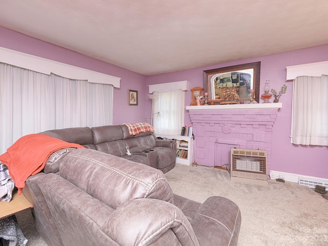 carpeted living room with a fireplace