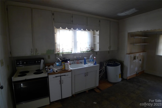 kitchen featuring white cabinetry, dark tile floors, sink, and white electric stove