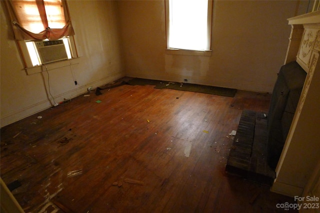 empty room with dark wood-type flooring