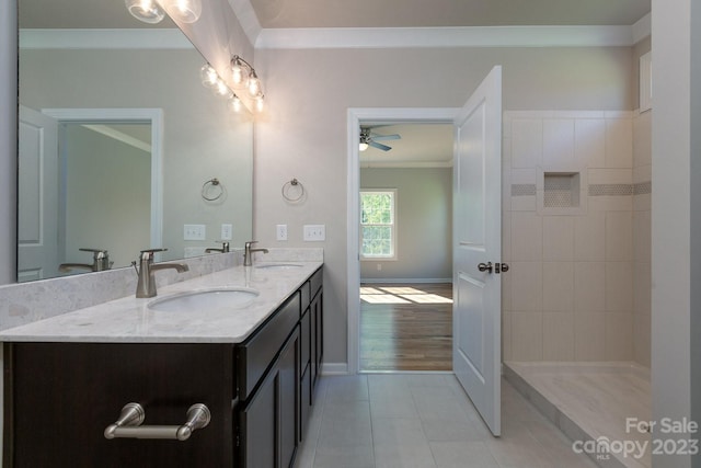 bathroom featuring ornamental molding, ceiling fan, double sink vanity, and tile flooring