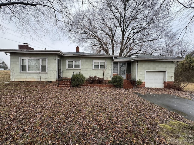 single story home featuring a garage