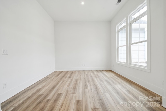 unfurnished room featuring light wood-type flooring