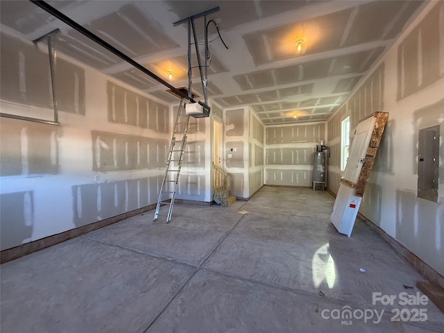 garage with a garage door opener, electric panel, and electric water heater