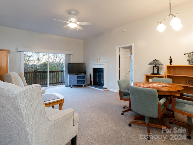 interior space featuring ceiling fan with notable chandelier