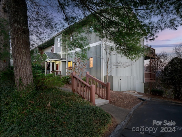 view of property exterior at dusk