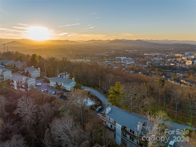 aerial view at dusk featuring a mountain view